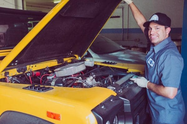 man holding open-wide car trunk - will bad o2 sensor cause misfire